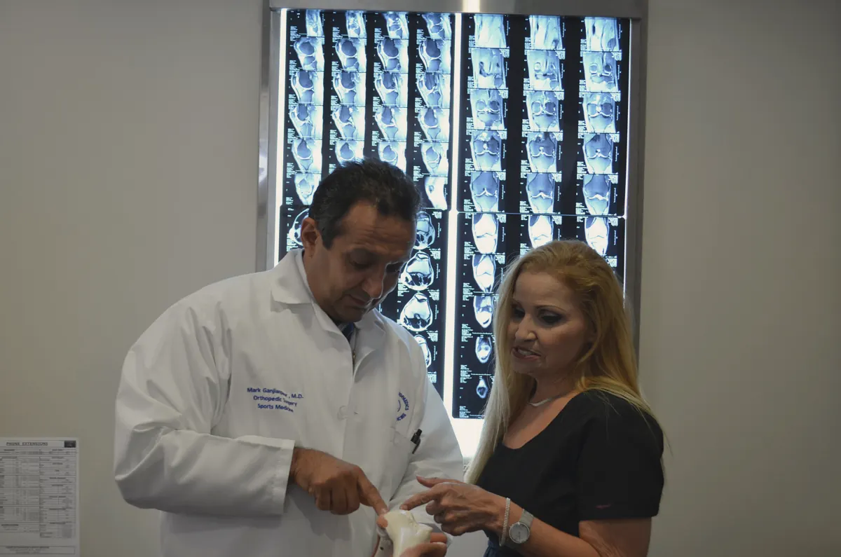 A physician explaining a treatment plan to a patient